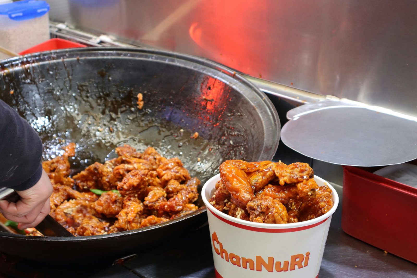 a bowl of food next to a bucket of food